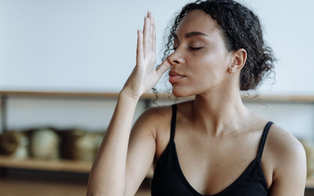 Woman in Black Tank Top Meditating